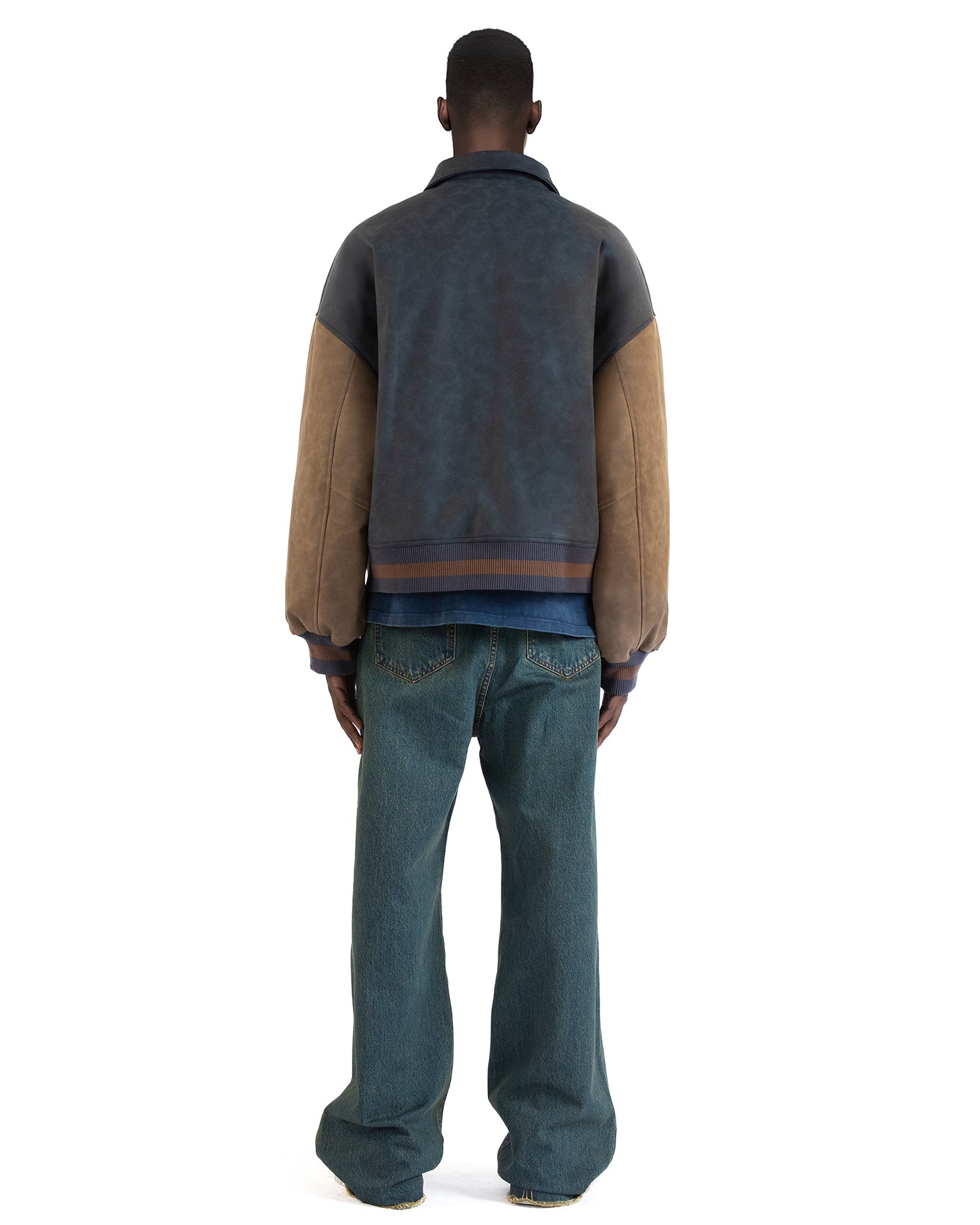 Untitled Artworks “Academy” varsity jacket in PU leather with front academy patch, oversized letterman style. on model back