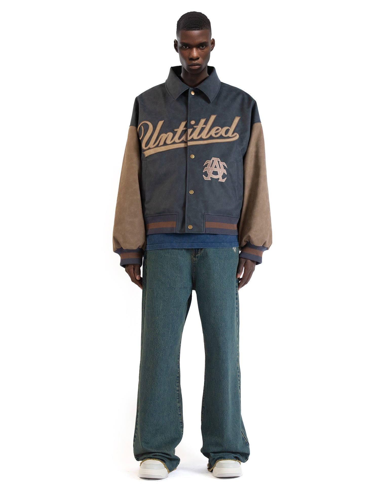 Untitled Artworks “Academy” varsity jacket in PU leather with front academy patch, oversized letterman style. on moel front