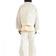 Untitled Artworks “Angel of Peace” varsity jacket in white with peace symbol embroidery and patches, oversized fit. back facing on model 