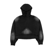 Flat view of the Untitled Artworks Consumed Hoodie in black, showcasing its oversized fit, kangaroo pocket, and unique stone wash effect.