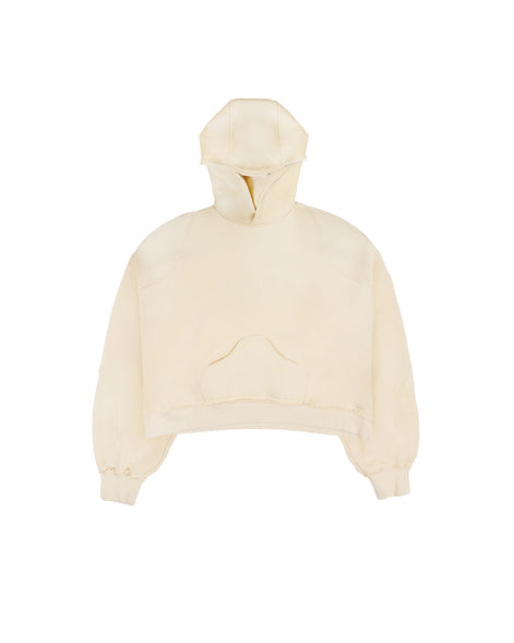 flat front view of the Untitled Artworks Consumed Hoodie in cream, showcasing its oversized fit, kangaroo pocket, and unique stone wash effect.