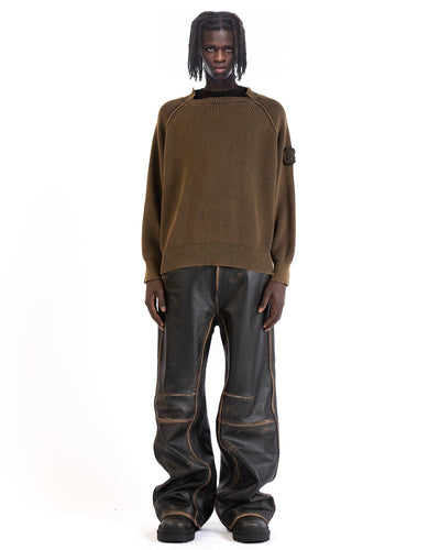 Untitled Artworks “Consumed” Ribbed Crewneck – brown cotton knit sweater with ribbed cuffs/hem and sleeve logo patch, enzyme-washed for a vintage feel. on model front
