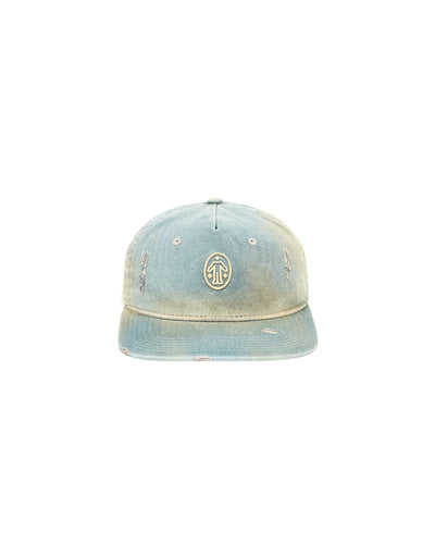 Untitled Artworks Essential Baseball Cap in Bleach Denim – light blue bleached denim 6-panel cap with adjustable strap and faded vintage finish. front flat