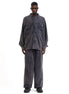 Front view of the blue corduroy shirt showing its button-front and boxy fit