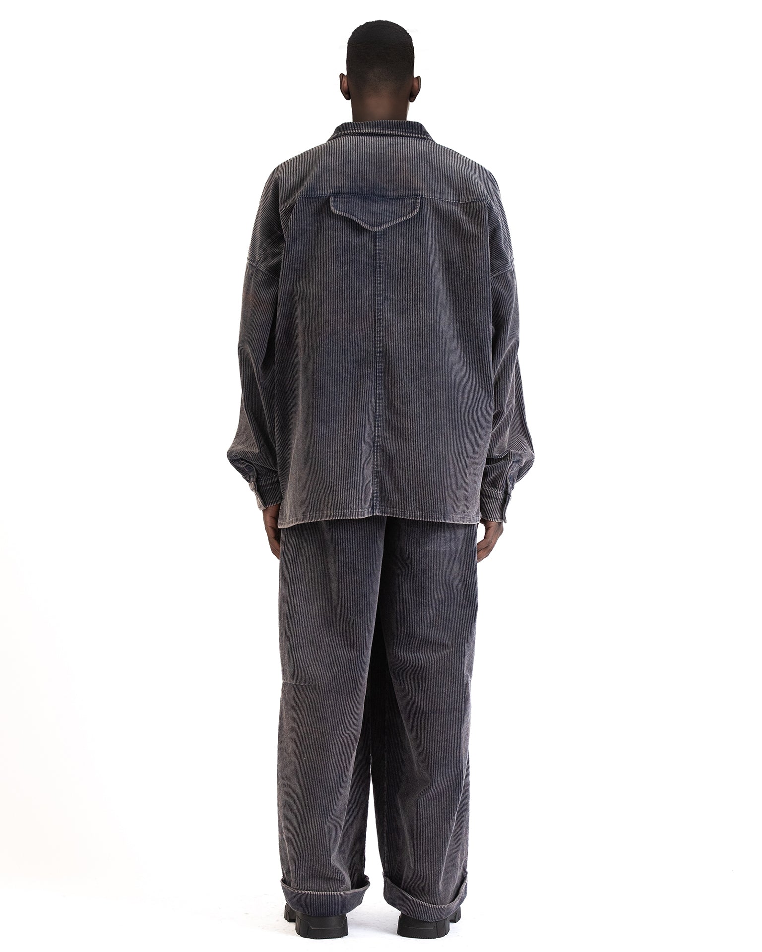 Back view highlighting dropped shoulders