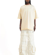 Front view of the Stencil graphic T-shirt showcasing its pleated front detail and stencil print