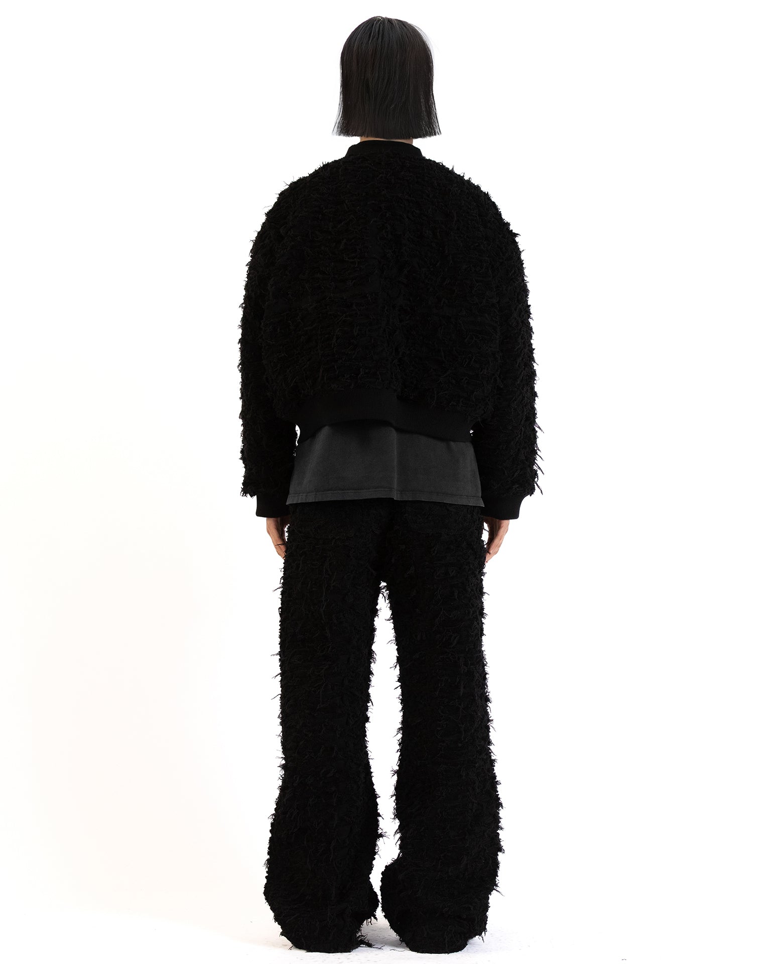 Side view showing ribbed collar and cuff details