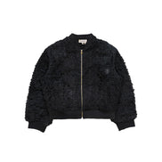 Close-up of distressed patchwork and custom zipper pull