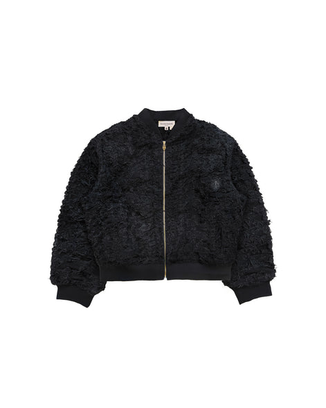 Close-up of distressed patchwork and custom zipper pull