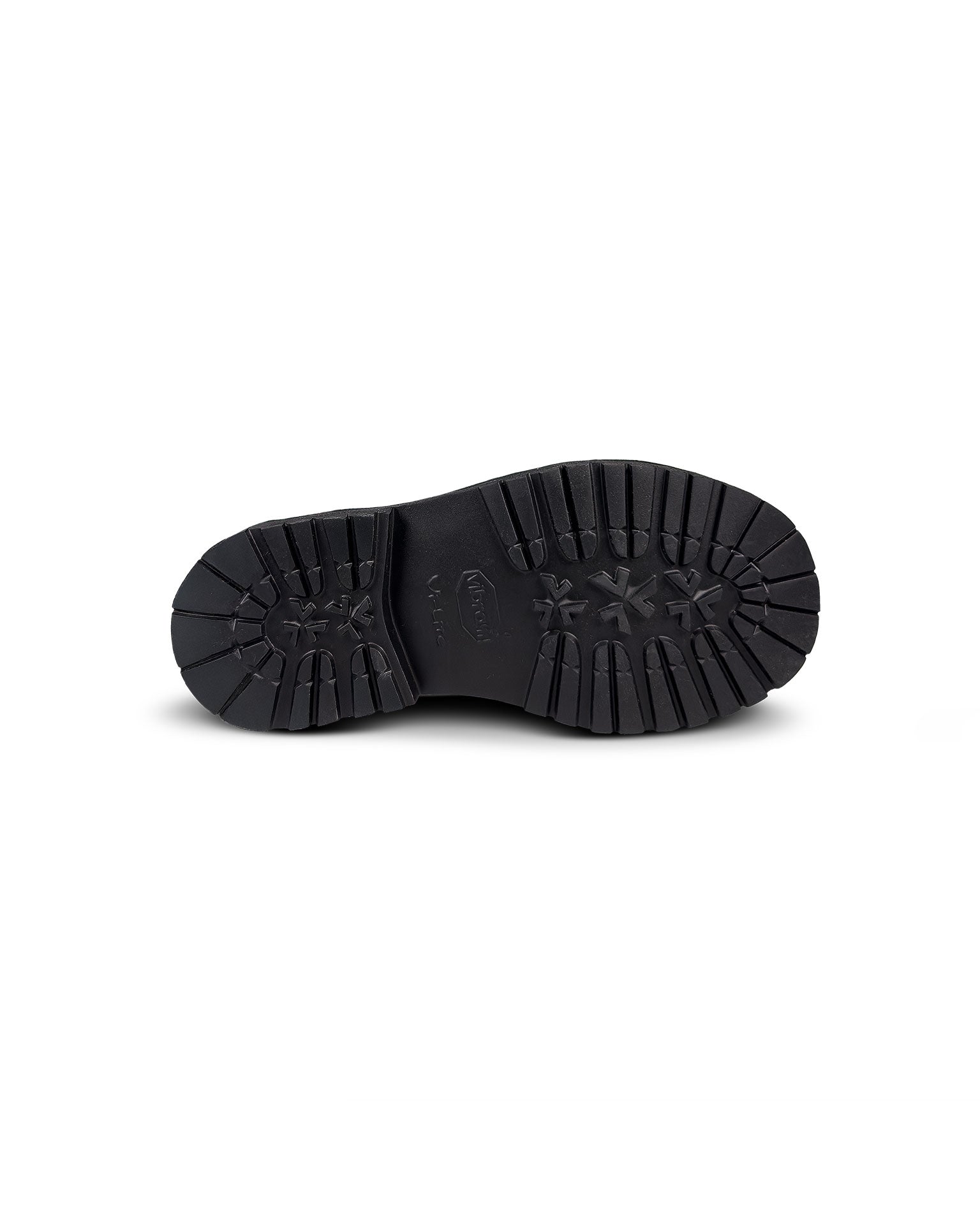 Close-up bottom view of the Untitled Artworks x Fracap Destroyer Boot in black, showcasing its spray-effect finish, oversized fold-over tongue, and antique brass eyelets.