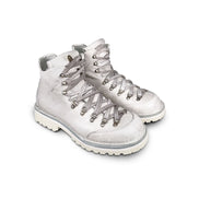 Close-up 3/4 view of the Untitled Artworks x Fracap Destroyer Boot in White, showcasing the distinctive spray-effect finish and premium leather construction.