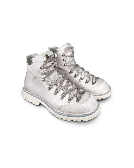 Close-up 3/4 view of the Untitled Artworks x Fracap Destroyer Boot in White, showcasing the distinctive spray-effect finish and premium leather construction.