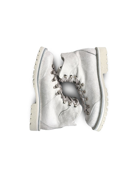 Close-up top down view of the Untitled Artworks x Fracap Destroyer Boot in White, showcasing the distinctive spray-effect finish and premium leather construction.