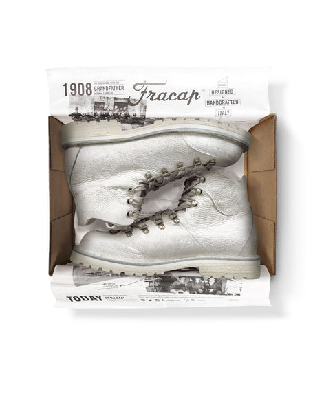 Close-up in box view of the Untitled Artworks x Fracap Destroyer Boot in White, showcasing the distinctive spray-effect finish and premium leather construction.