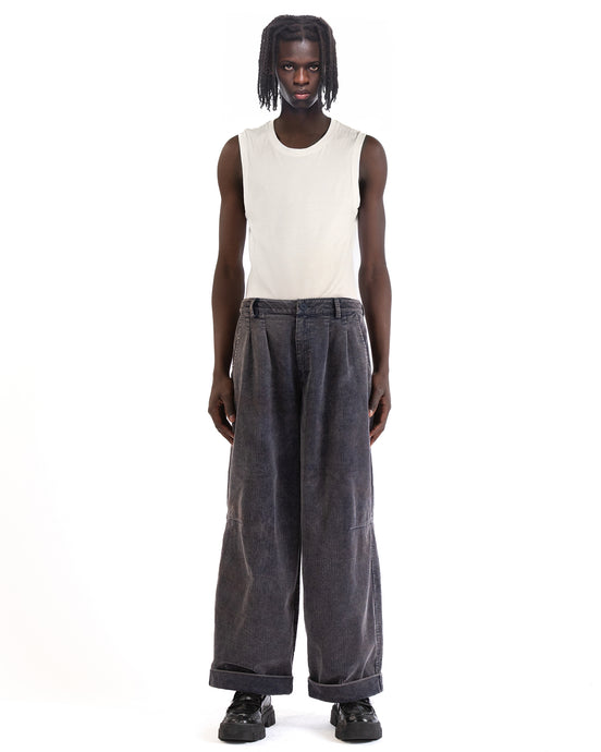 Front view of the blue corduroy pants showing the wide-leg cut and pleated front