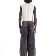Back view with mid-rise waist and flap pockets