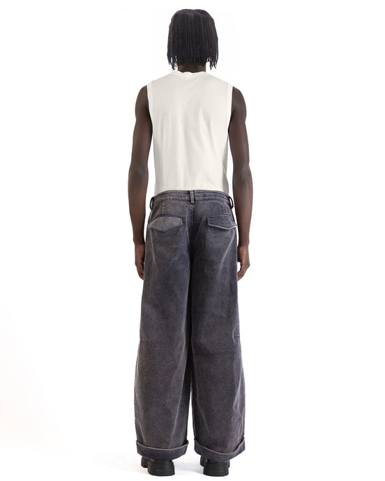 Back view with mid-rise waist and flap pockets