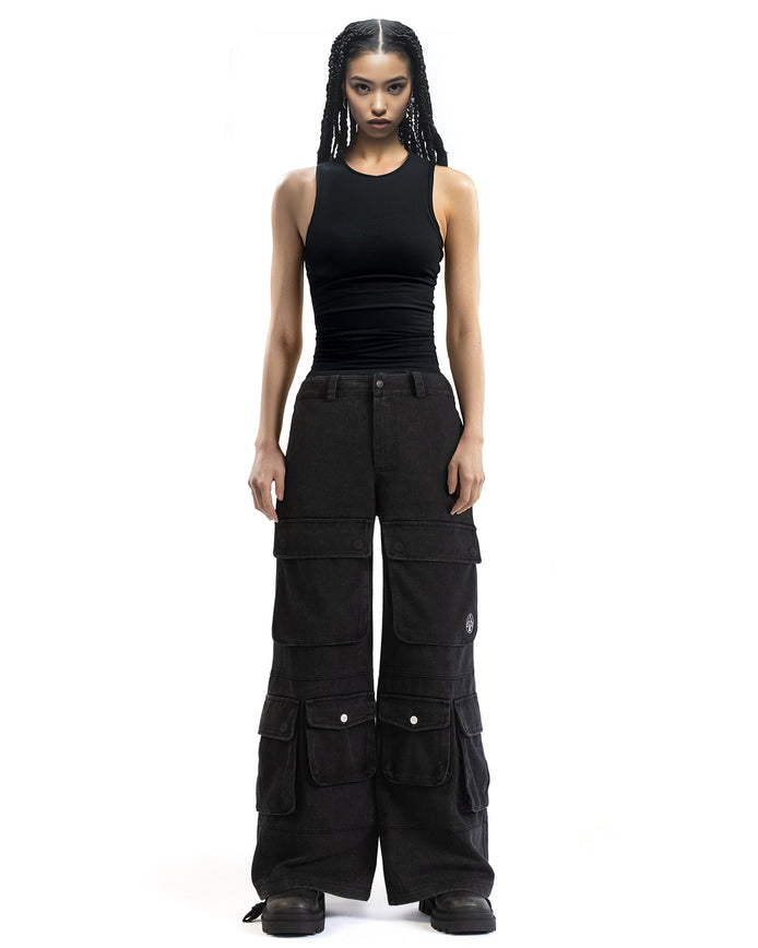 Front view of wide-leg washed black cargo pants showcasing the oversized fit and multiple pockets