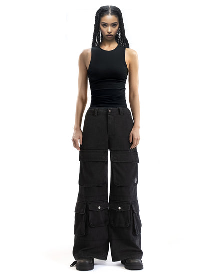 Front view of wide-leg washed black cargo pants showcasing the oversized fit and multiple pockets
